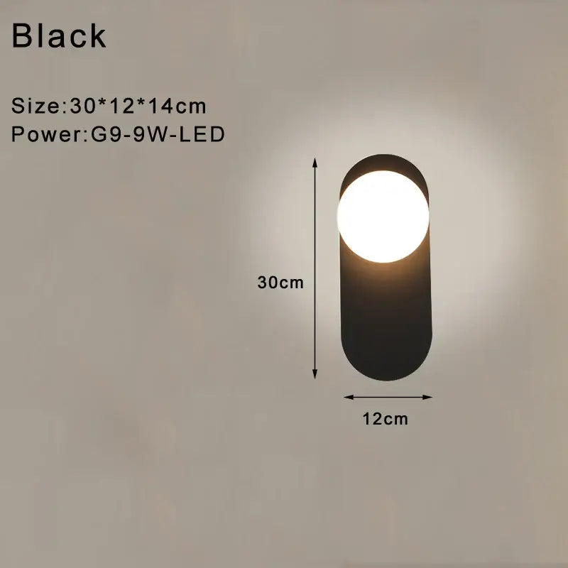 Modern minimalist black oval wall lamp with frosted glass led light and matte finish for bedroom use