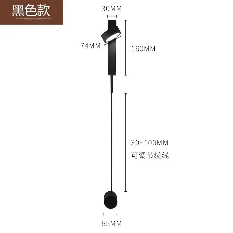 Modern minimalist black and gold wall light sconce with adjustable circular head and cylindrical base for bedroom use