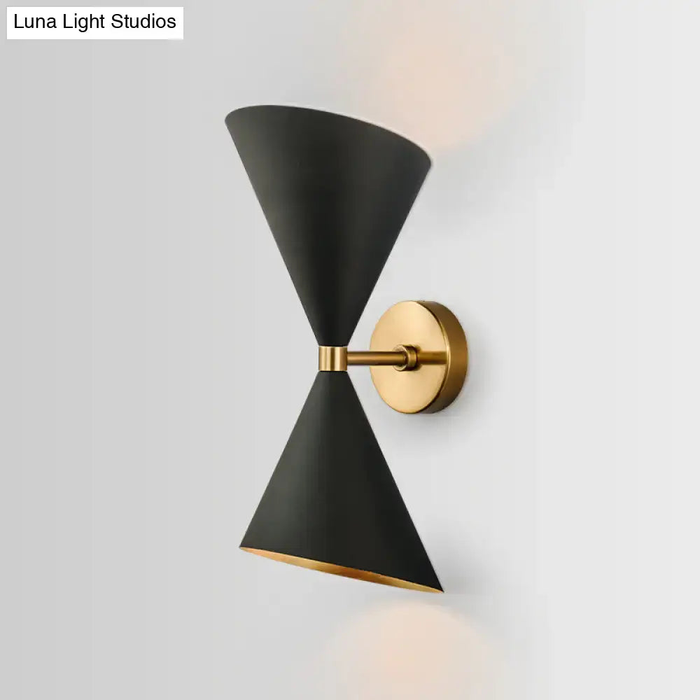 Modern minimalist black matte conical wall light fixture with gold-toned brass accents for bedroom sconce lighting