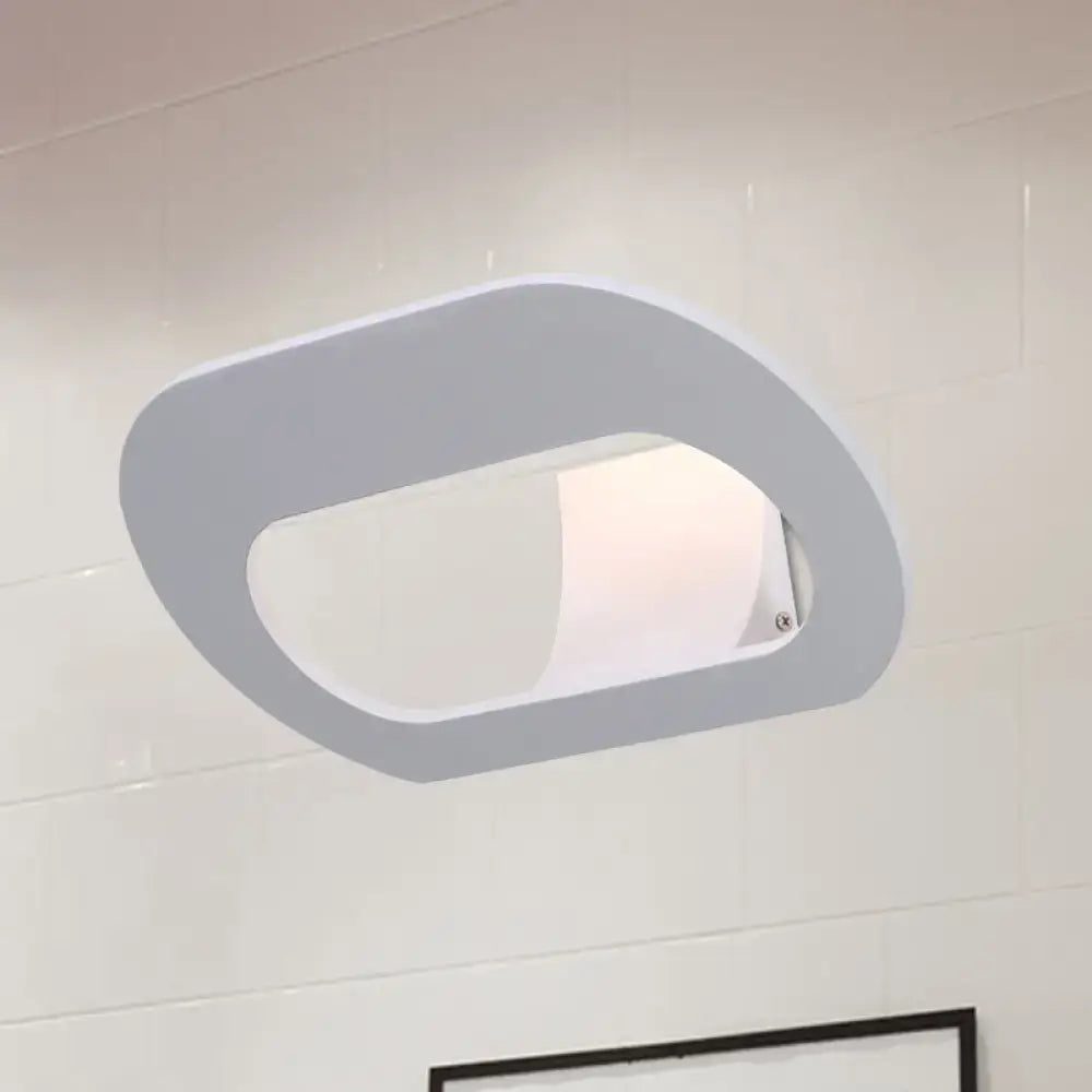 Modern minimalist black and grey oval shade wall lamp with sleek oval shade design suitable for bedroom lighting