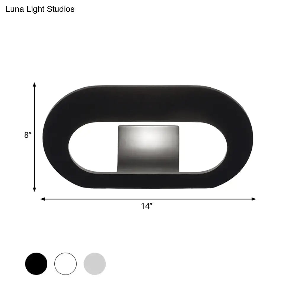 Modern minimalist black wall lamp with oval shade and integrated light source for bedroom lighting maximum bulb wattage included