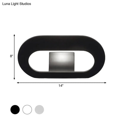 Modern minimalist black wall lamp with oval shade and integrated light source for bedroom lighting maximum bulb wattage included