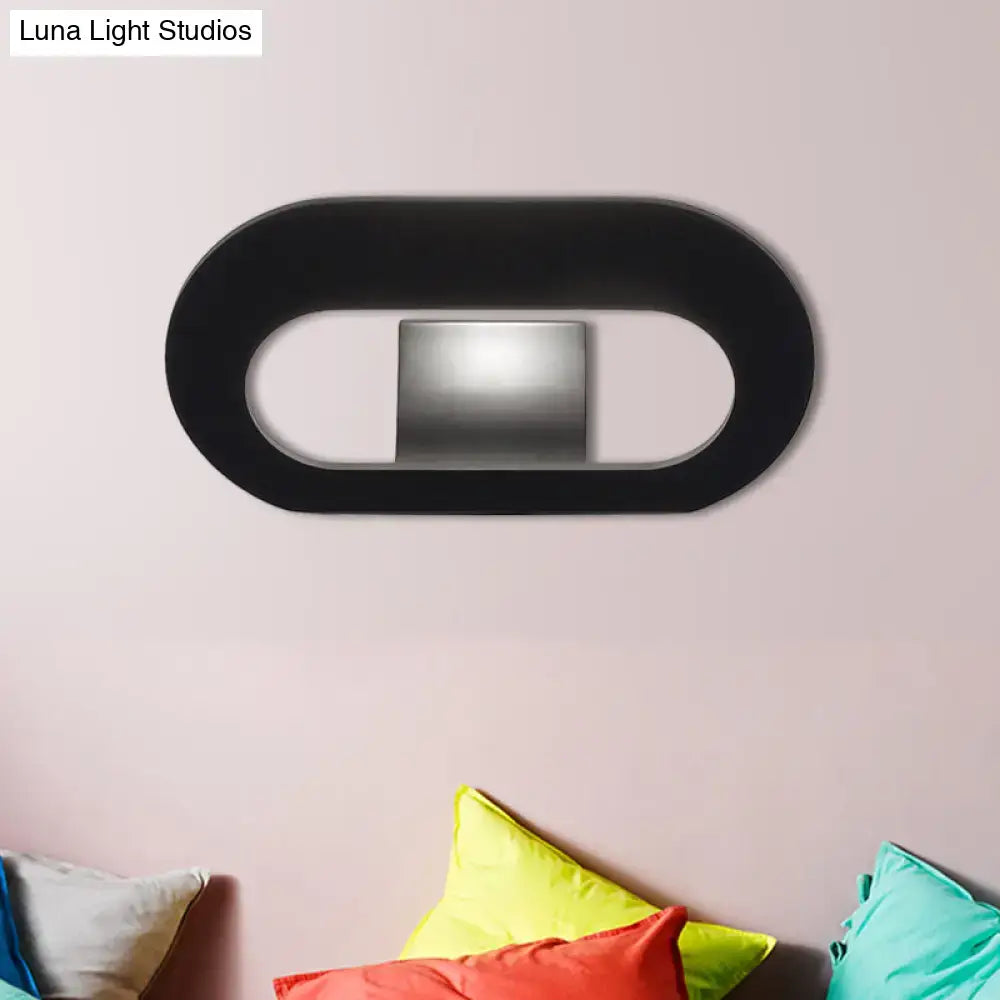 Modern minimalist black wall lamp with oval shade and metallic light panel suitable for bedroom lighting with max bulb wattage