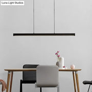 Black minimalist led ceiling light bar with sleek rectangular design and thin cords for kitchen island lighting