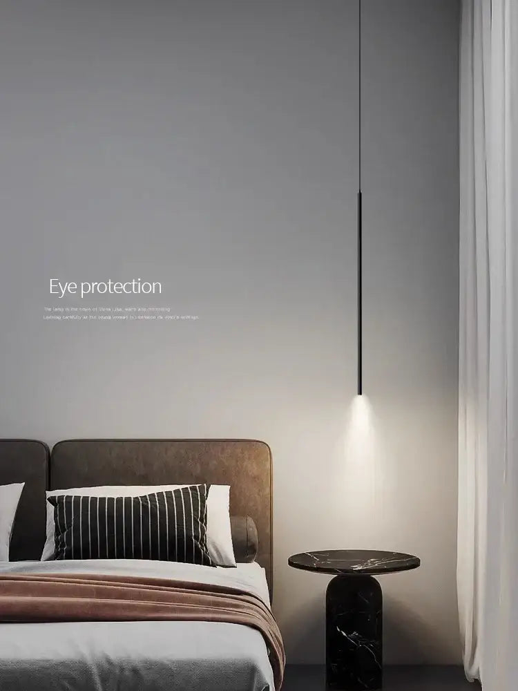 Black minimalist DecorBites led pendant light with sleek cylindrical design and warm focused illumination for modern décor