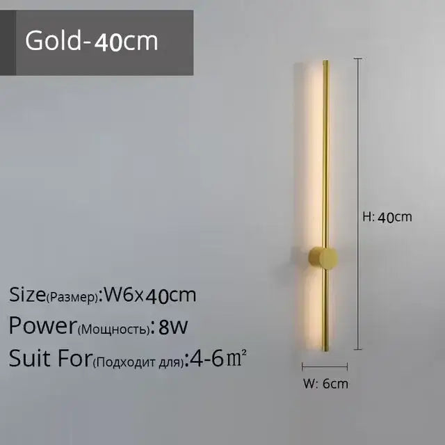 Gold-colored sleek modern wall lamp with slim vertical bar and circular base for decorbites led strip wall lighting