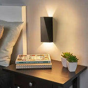 Modern black rectangular led wall lamp with sleek minimalist design for bedroom reading and ambient lighting