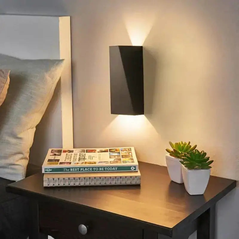 Modern black rectangular led wall lamp with sleek minimalist design for bedroom reading and ambient lighting