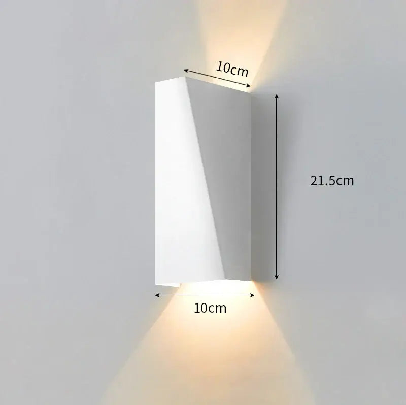 Modern minimalist black led wall lamp with a white rectangular sconce and warm ambient lighting for bedroom reading