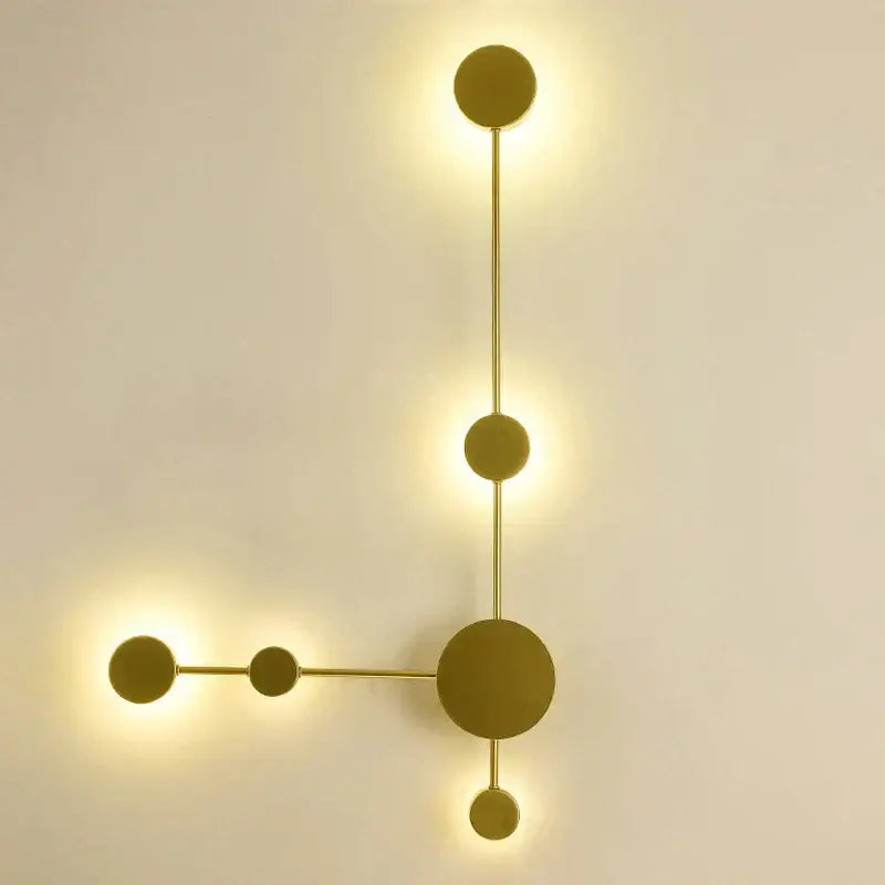 Modern minimalist gold-toned led wall lamp with spherical lights and geometric branching design for living room