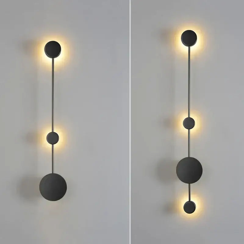 Modern minimalist black led wall lamp with spherical design and warm ambient lighting for living space use