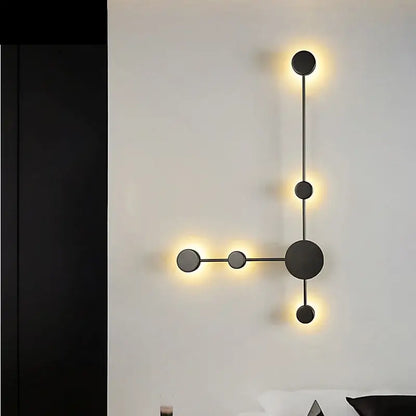 Modern minimalist black led wall lamp featuring five circular lights in an asymmetrical geometric design for living room