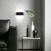 Modern minimalist black led wall light with sleek rectangular center and oval frosted glass diffuser for bedroom decorbites led wall