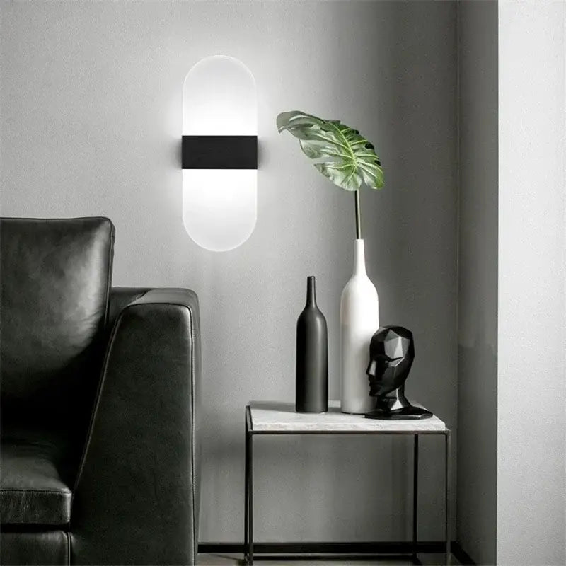 Modern minimalist black led wall light with sleek rectangular center and oval frosted glass diffuser for bedroom decorbites led wall