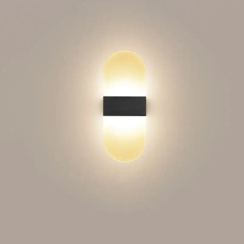 Modern minimalist black led wall light with sleek rectangular center and warm glowing oval diffusers for bedroom decorbites led wall light