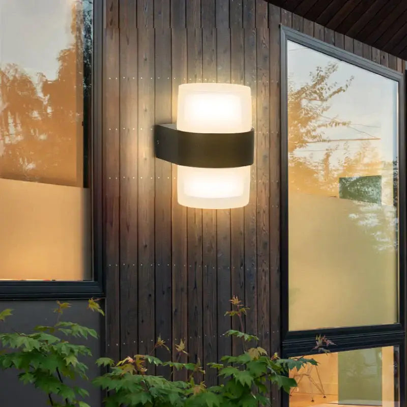 Modern minimalist black led wall light with frosted glass and sleek design for indoor and outdoor use