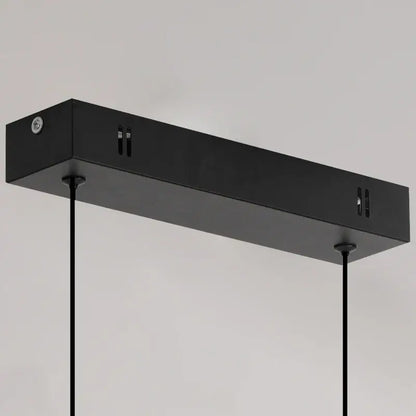 Black rectangular linear pendant light with sleek modern design and matte finish for dining room lighting