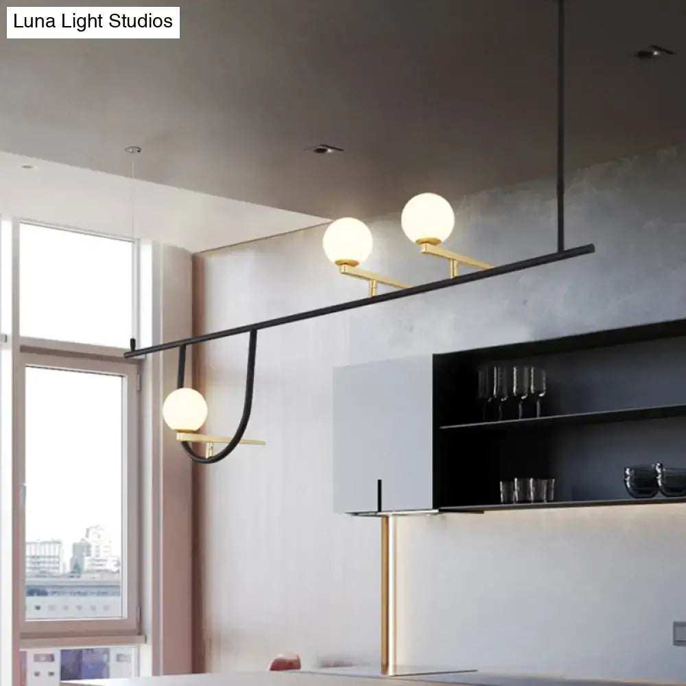 Modern black and gold metal ceiling light with three frosted glass globes for dining room fixture height adjustment