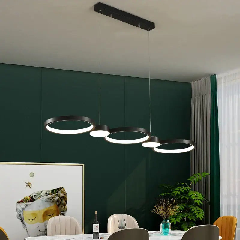 Modern black ring led chandelier with illuminated circular rings suspended from a rectangular ceiling mount for living room decorbites black ring