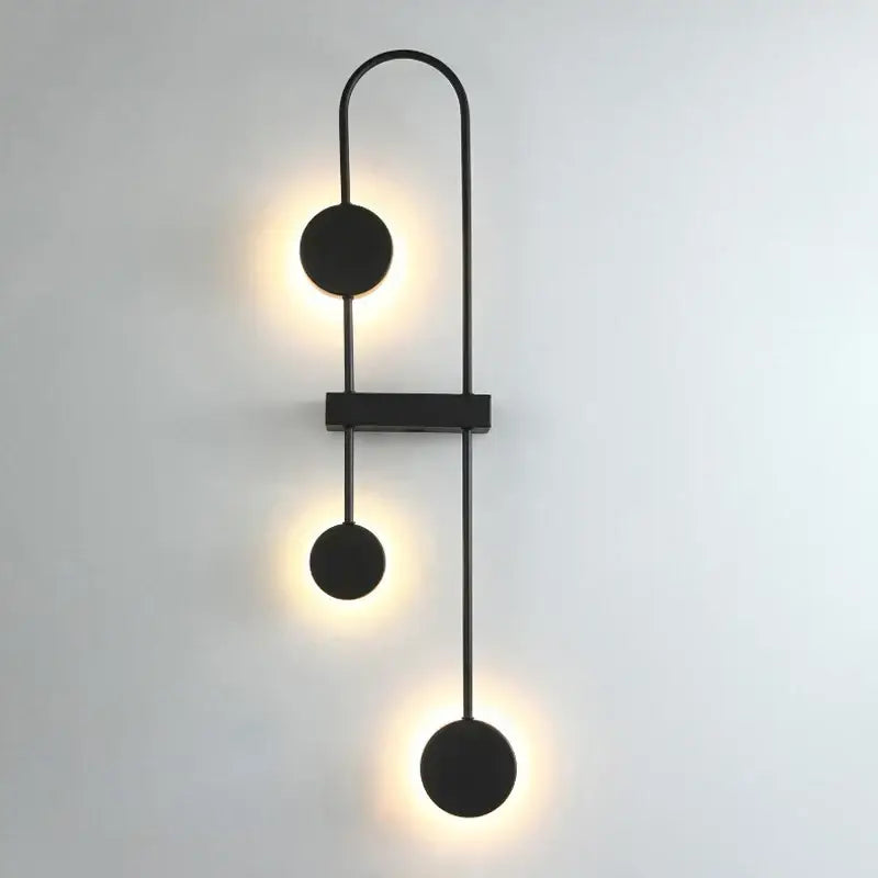 Modern minimalist black triple circle led wall light with three warm glowing fixtures for bedroom decorbites led wall light