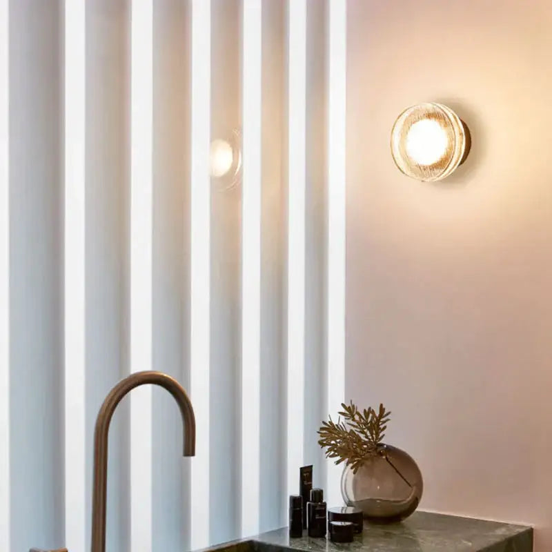 Modern minimalist black wall lamp featuring a warm-toned textured frosted glass wall lamp for bathroom decorbites light luxury