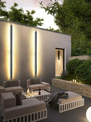 Modern minimalist outdoor lounge set with sleek white metal frames and gray cushions complements decorbites black waterproof wall light