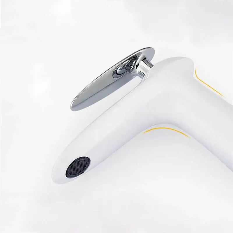 Modern minimalist white brass bathroom faucet with polished chrome spout and subtle yellow accents by decorbites black