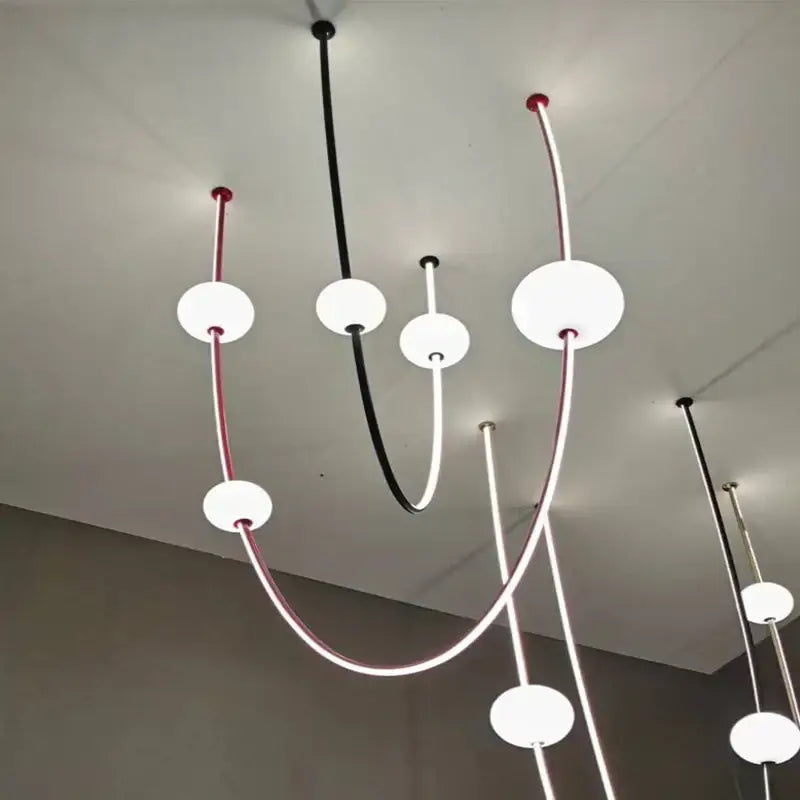 Modern minimalist black and white colorized led dimmable ceiling chandelier with curved rods and frosted glass globes