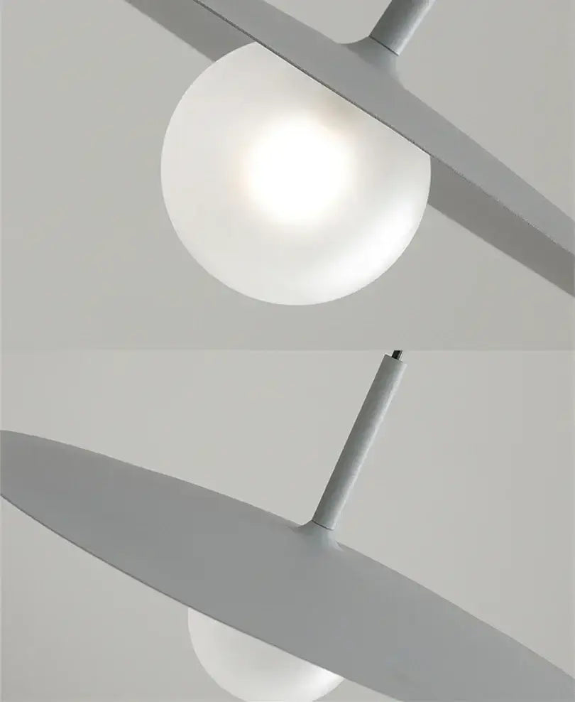 Modern minimalist black and white decorbites flying saucer dining room light with frosted glass shades and matte gray metal arms