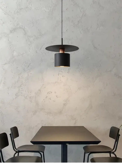 Modern minimalist black pendant lights with cylindrical shade and copper accent for elegant led pendant kitchen lighting