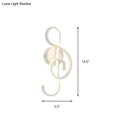 A sleek modern black white led ring sconce shaped like a treble clef for minimalist bedroom wall lighting