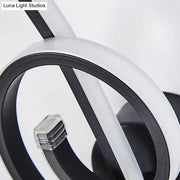 Modern minimalist black white led ring sconce with sleek circular rings and transparent led module for bedroom wall light