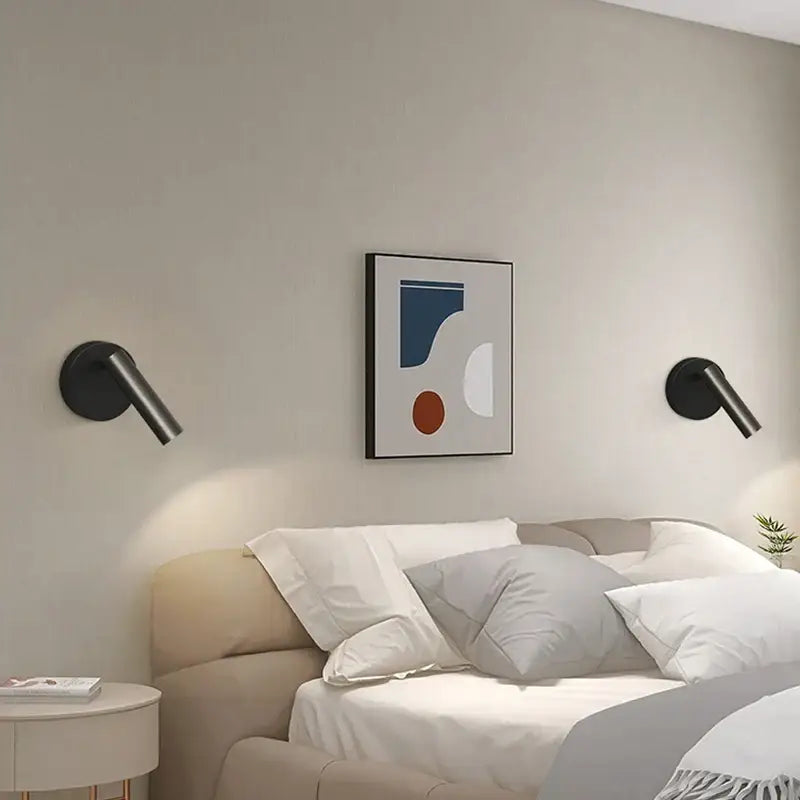 Black minimalist led wall lamp with sleek angled arms designed as a modern bedroom spotlight wall lamp
