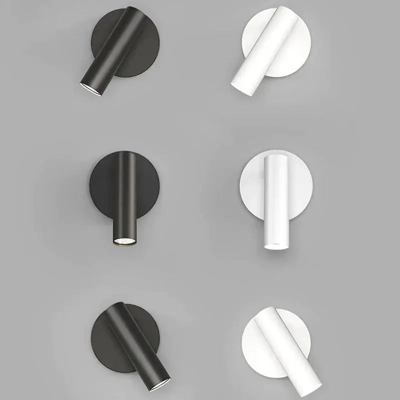 Modern minimalist black and white led wall lamp featuring cylindrical fixtures and circular backplates for bedroom lighting