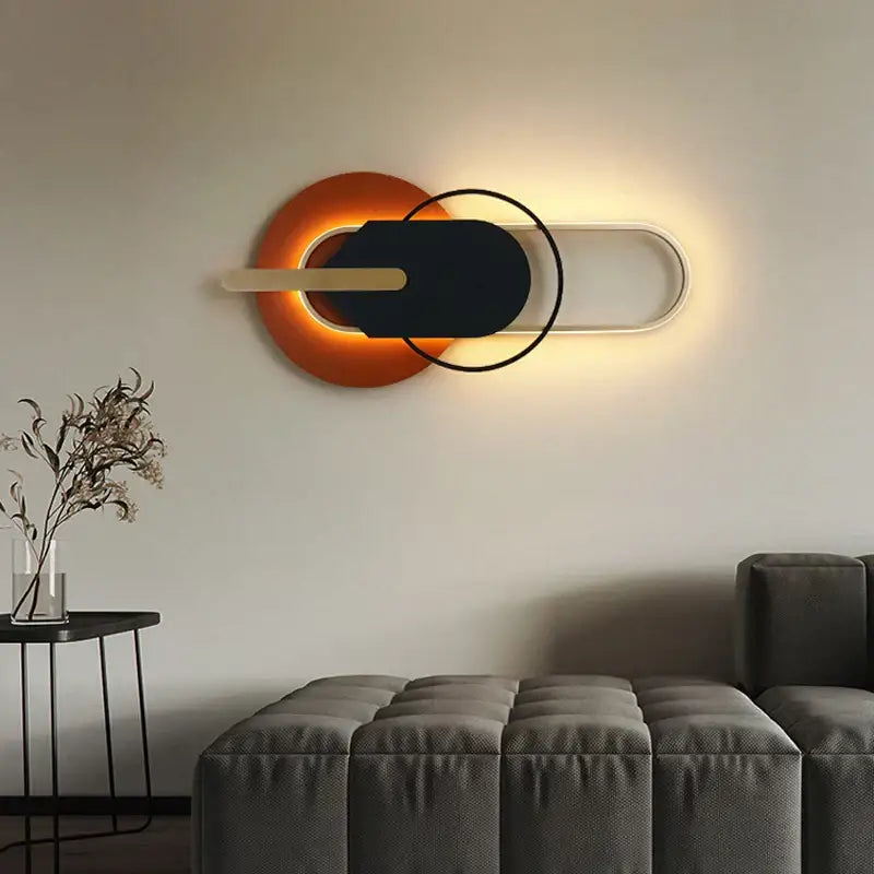 Modern minimalist black and white led wall lamp with orange backlit element and black center for bedroom living room decorbites led wall