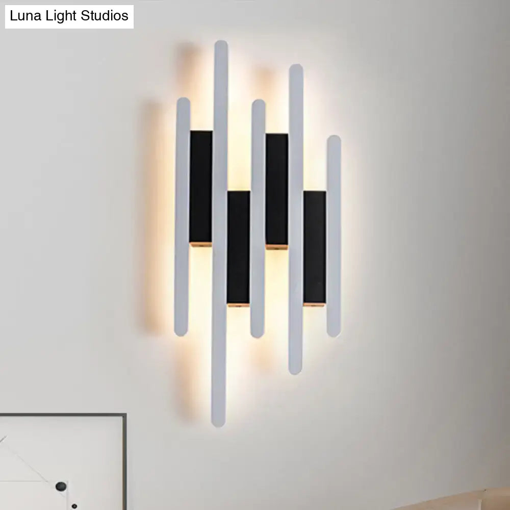 Modern minimalist black and white led wall sconce with five bars and warm white light for bedroom ambient lighting