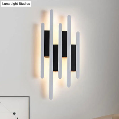 Modern minimalist black and white led wall sconce with five bars and warm white light for bedroom ambient lighting