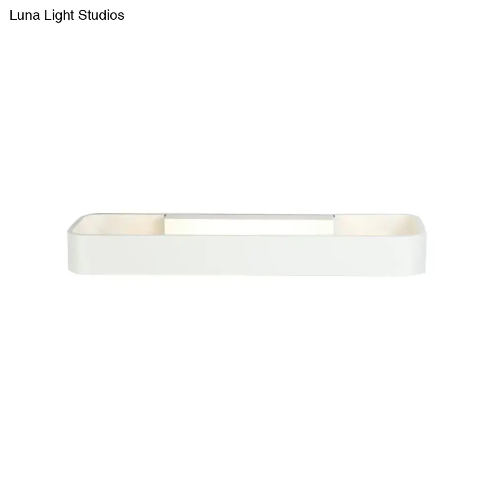 Minimalist white rectangular wall lamp with sleek modern design and smooth matte finish for bedroom lighting