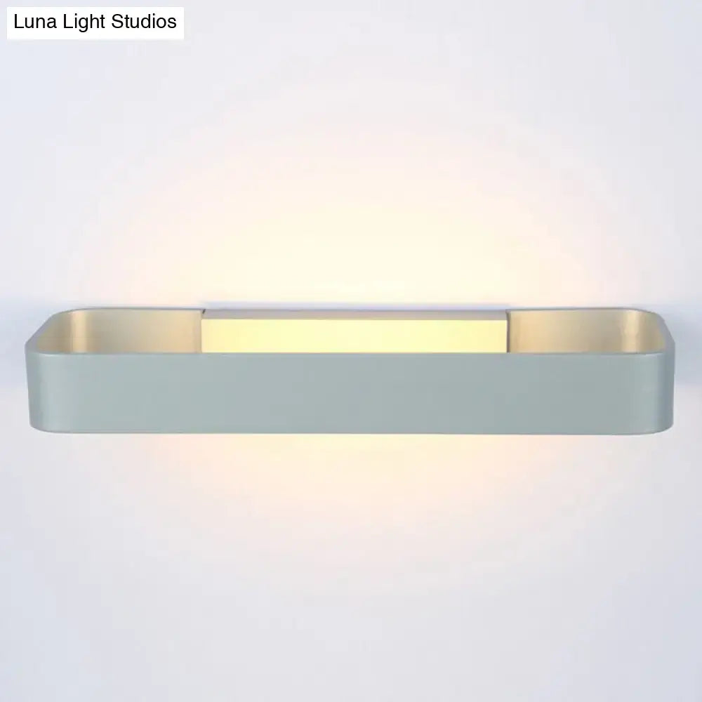Modern minimalist black and white rectangular wall lamp with matte gray finish and warm yellow LED light strip for bedroom use