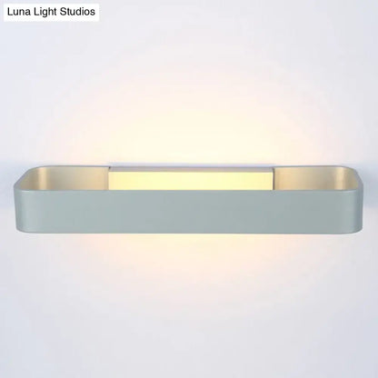 Modern minimalist black and white rectangular wall lamp with matte gray finish and warm yellow LED light strip for bedroom use