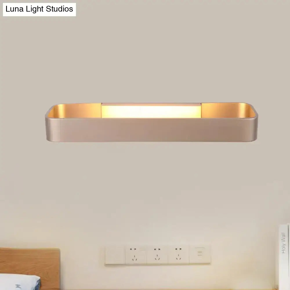 Modern minimalist black and white rectangular wall lamp with brushed gold finish and sleek minimalist design for bedroom lighting