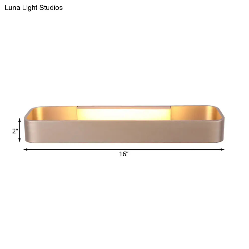 Modern minimalist wall lamp with sleek brushed gold finish and warm evenly distributed light for bedroom use