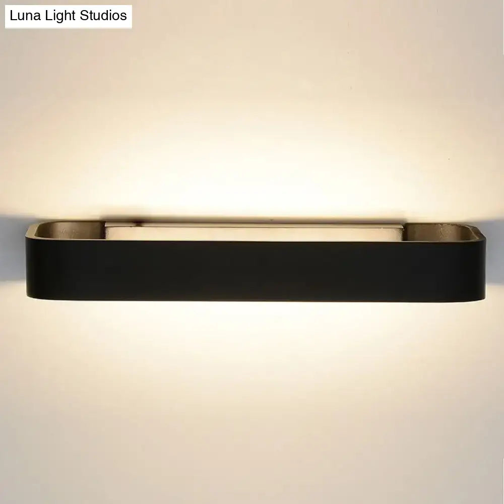 Modern minimalist black rectangular wall lamp with metallic accents for bedroom lighting and wall mounting