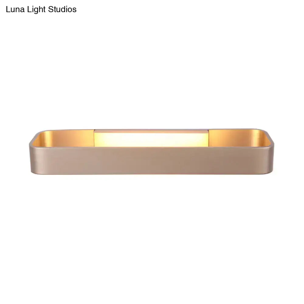 Modern minimalist black and white rectangular wall lamp with sleek gold metal frame and warm led lighting for bedroom use