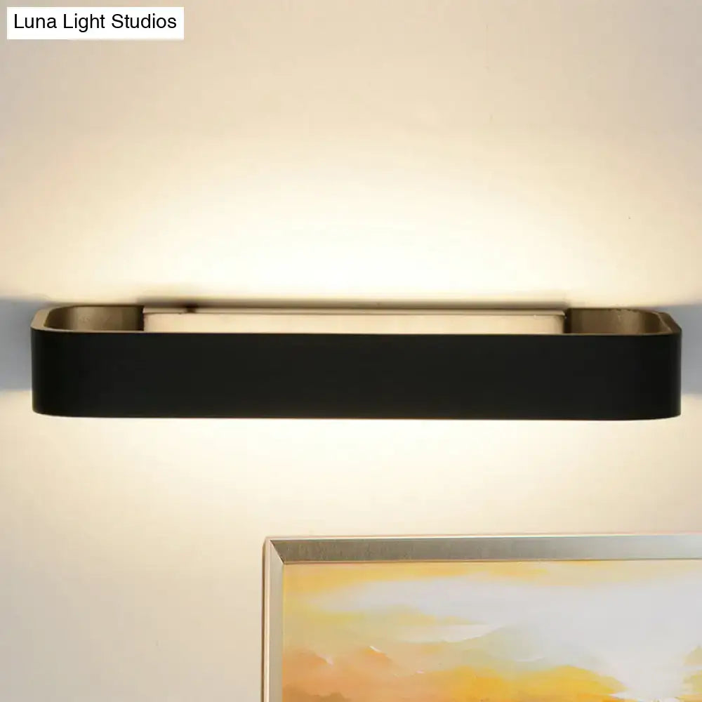 Black rectangular modern minimalist wall lamp with sleek design ideal for bedroom lighting