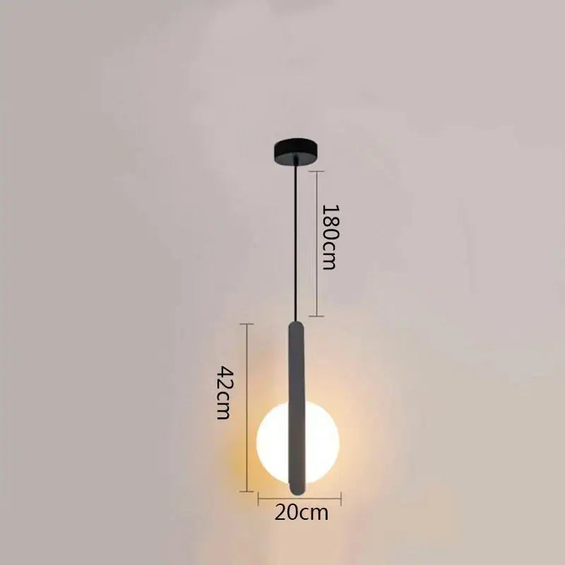 Minimalist black ring pendant lamp with sleek cylindrical shade and glowing bulb for modern dining room decorbites black ring