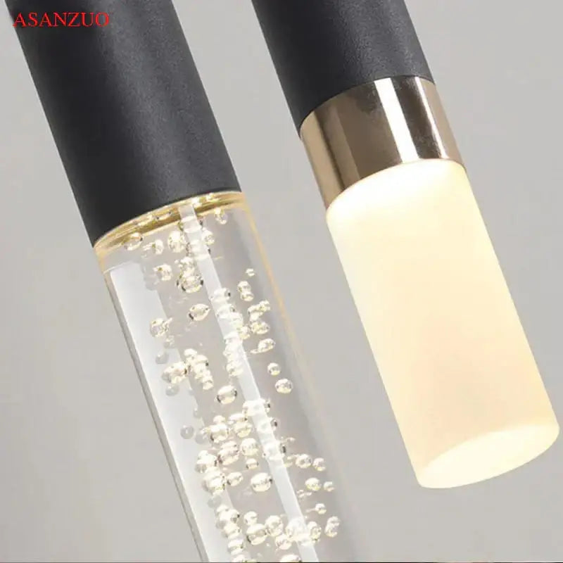 Modern minimalist black ring pendant lamp with gold and clear glass bubble details for dining room decorbites black ring decor