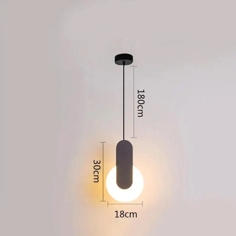 Minimalist black ring pendant lamp with sleek cylindrical shade and glowing bulb ideal for modern dining room decorbites black ring