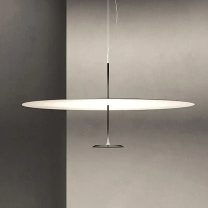 Modern minimalist black and white saucer pendant light with sleek chrome rod and base for cord pendant installation