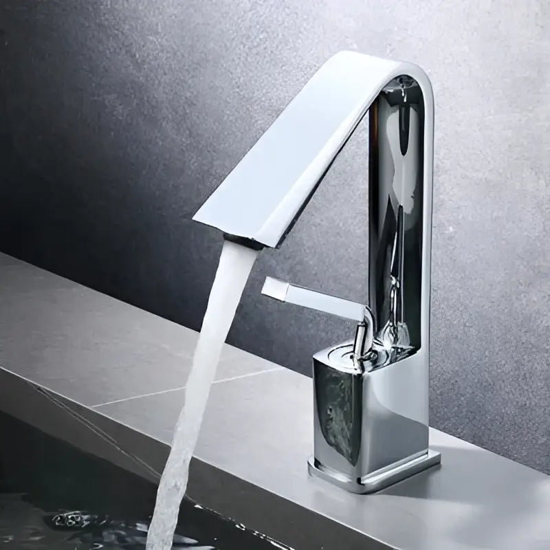 Modern minimalist basin faucet with chrome finish, sleek rectangular spout, and square base for bathroom sink decorbites brush gold style